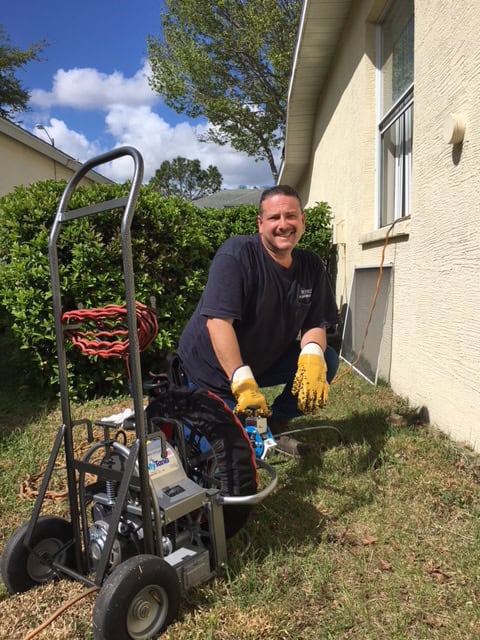 Perez Plumbing technician on the job in Pasco County